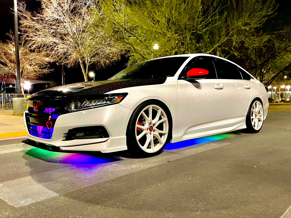 Honda outdoors with dynamic colorshift LED underbody kit installed.