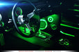 Car interior with green LED footwell lighting.