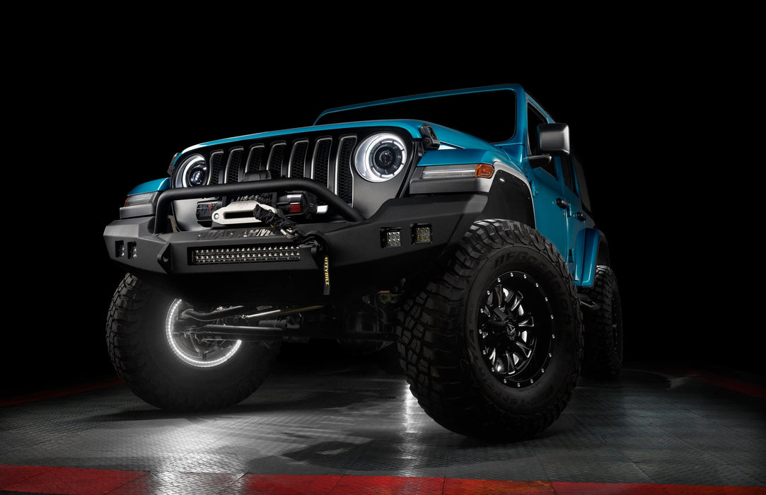 Aqua jeep with white LED halos and wheel rings.