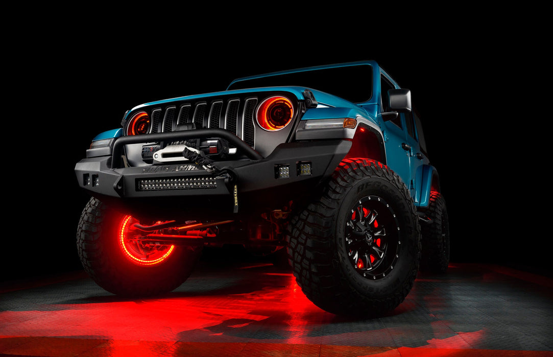 Aqua jeep with red LED halos and wheel rings.