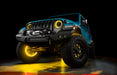 Aqua jeep with yellow LED halos and wheel rings.