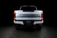 Straight rear view of a white Ford Superduty with Flush Mount Tail Lights installed and brake lights on.