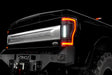 Close up on the rear end of a black Ford Superduty with Flush Mount Tail Lights installed, and reverse lights on.
