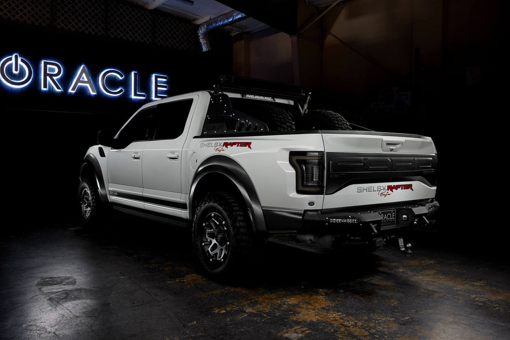 Rear three quarters view of white Ford Raptor with Tinted Flush Style LED Tail Lights installed