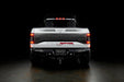 Rear view of white Ford Raptor with Flush Style LED Tail Lights installed and running lights turned on