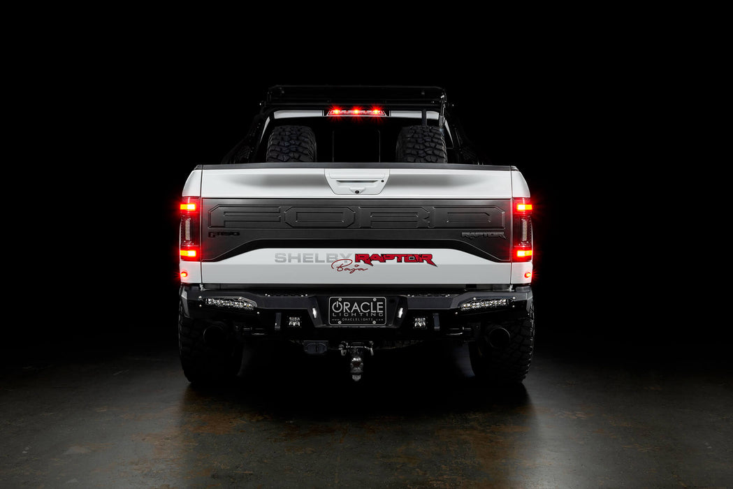 Rear view of a white Ford Raptor with Flush Style LED Tail Lights installed and brake lights on