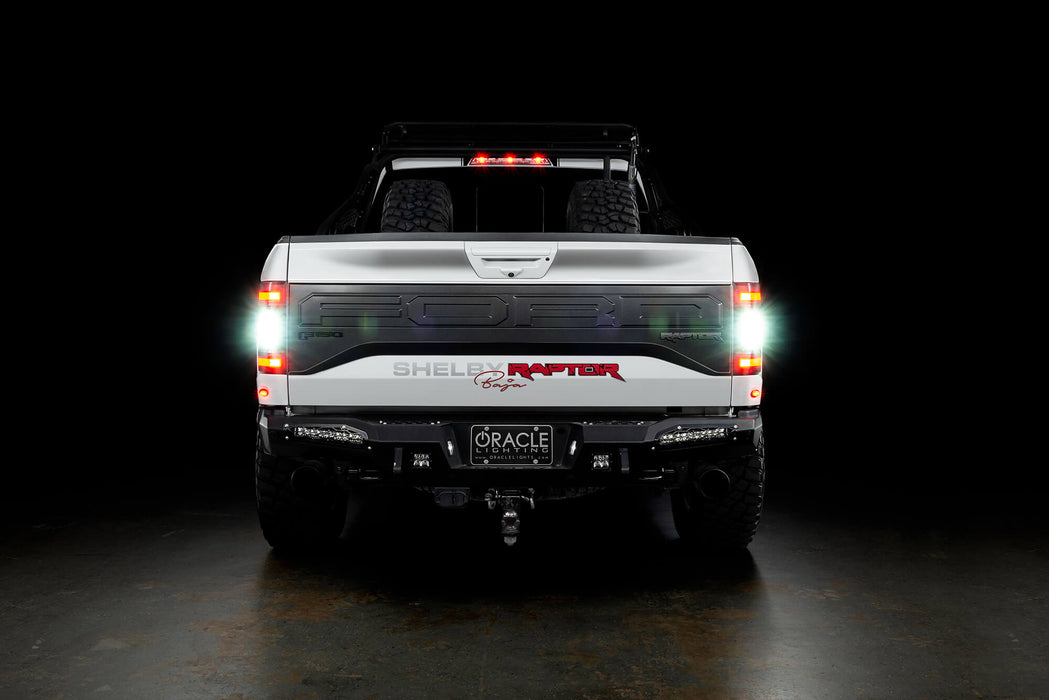 Rear view of white Ford Raptor with Flush Style LED Tail Lights installed and reverse lights turned on