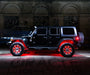 Side view of black Jeep with red LED wheel rings.