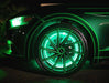 Close-up view of green LED wheel rings installed on a Mustang.