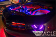 Camaro close-up with engine bay lit up.