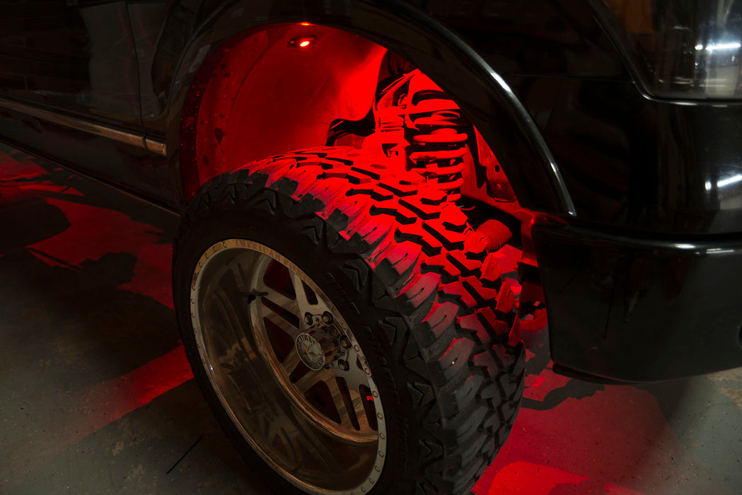 Close-up of wheel well with red rock light glowing.
