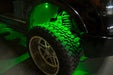 Close-up of wheel well with green rock light glowing.