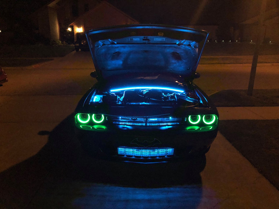 Challenger in a driveway with engine bay illuminated by LED lighting strips.