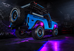 Blue ORACLE Lighting Jeep with purple rock lights shining.