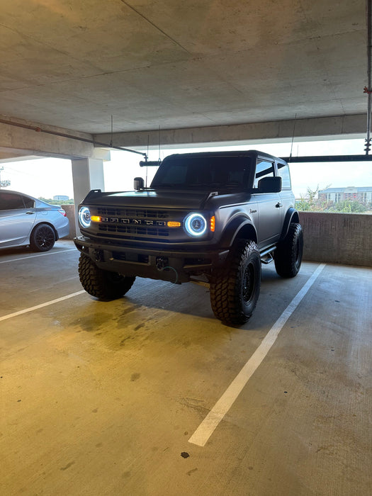 Ford Bronco in a parking garage, with Oculus Headlights turned on.