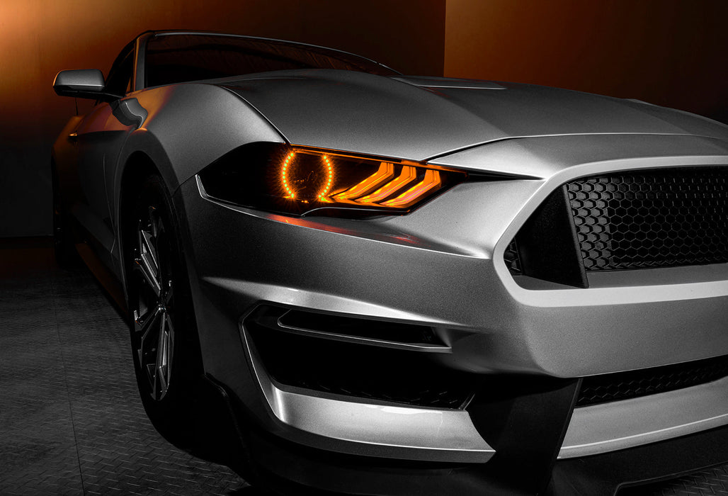 Close-up view of Ford Mustang headlight with amber LEDs.