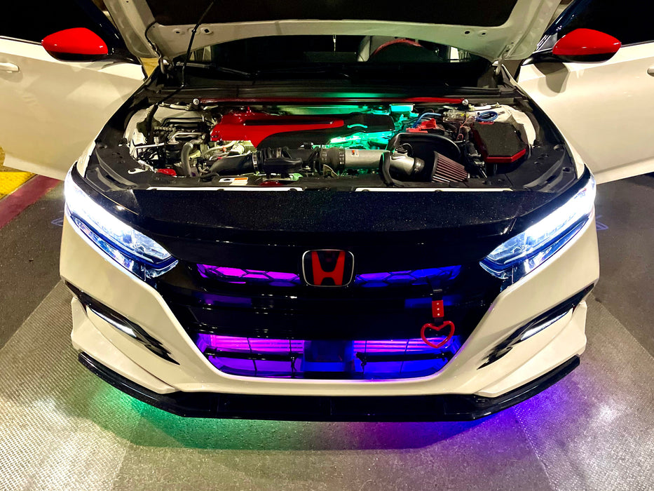 Front view of honda with hood open and LED underglow.