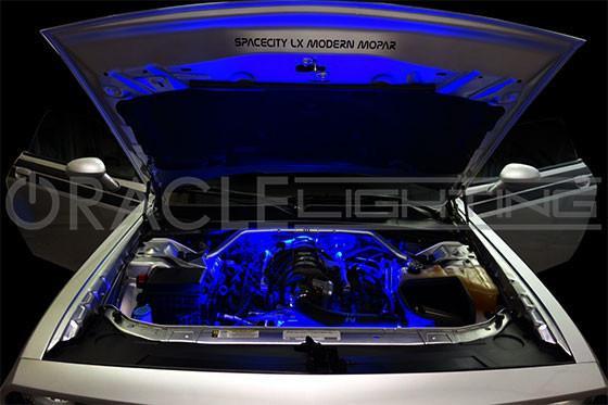 White challenger with blue engine bay lighting.