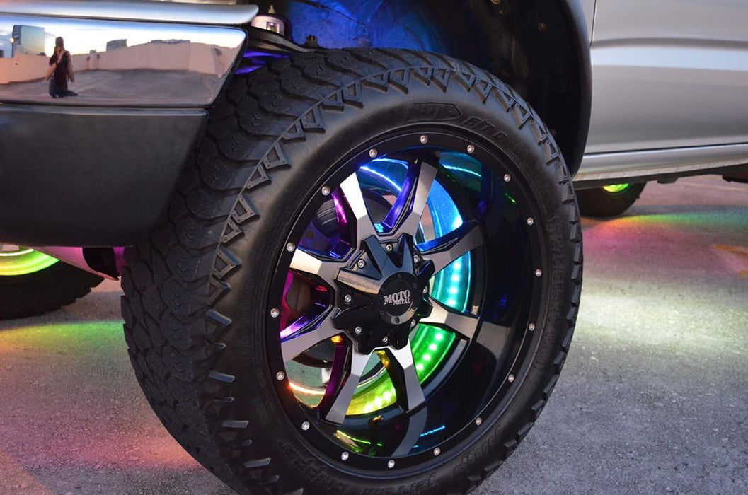 Close-up of a wheel with dynamic colorshift wheel rings installed, with rainbow LEDs.