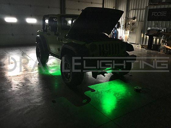 Jeep green rock lights turned on in garage.