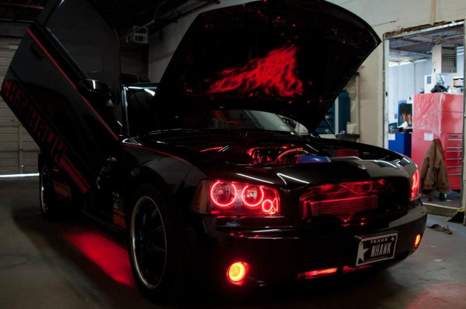 Charger with red engine bay lighting kit installed.