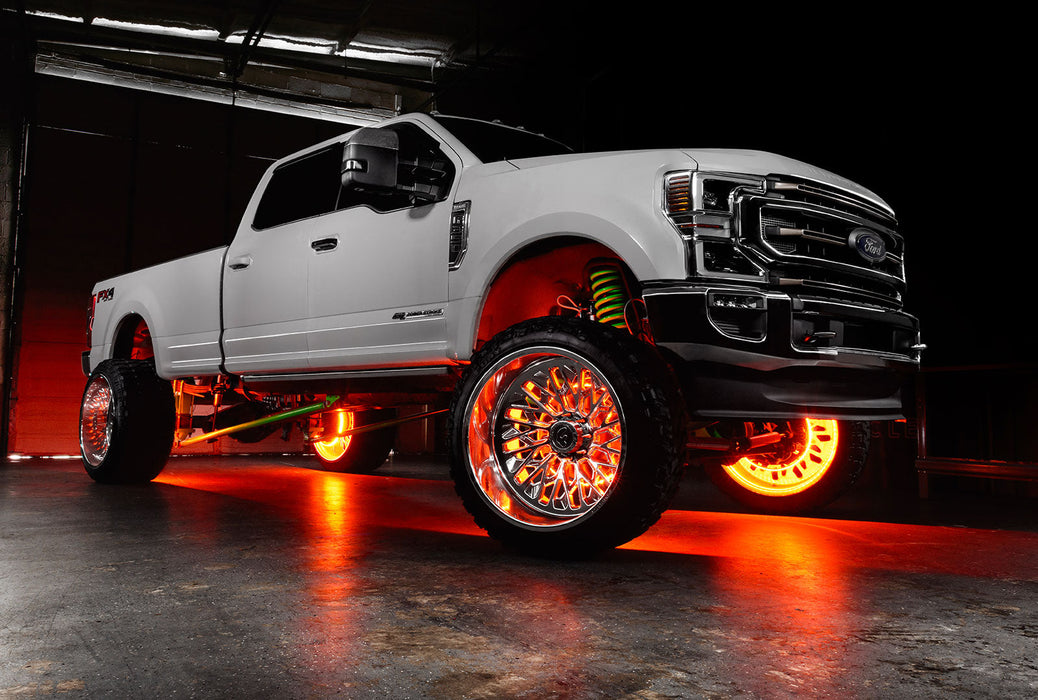 White Ford Superduty with amber LED wheel rings.
