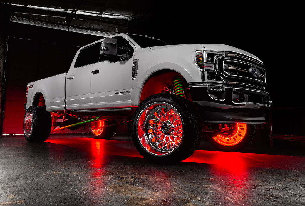 White Ford Superduty with red LED wheel rings.
