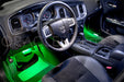Car interior with green LED footwell lights.