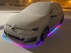 Snow covered VW with dynamic colorshift rainbow underglow.