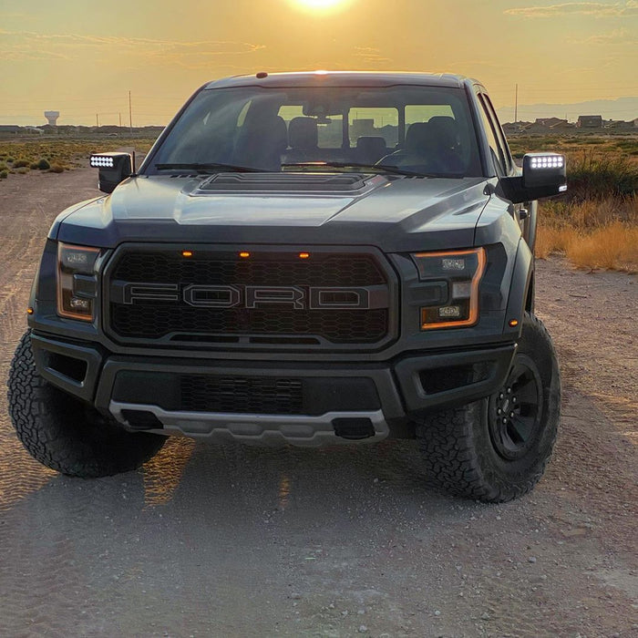 Front view of a Ford Raptor with 2015-2020 Ford F-150 LED Off-Road Side Mirrors installed.