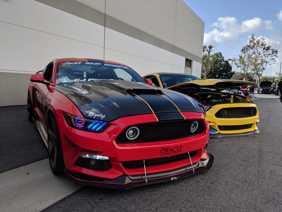 Two Ford Mustangs next to each other with Dynamic ColorSHIFT Pre-Assembled Headlights installed.