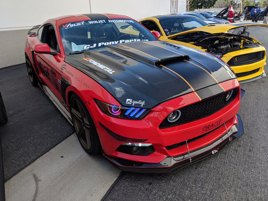 Two Ford Mustangs next to each other with Dynamic ColorSHIFT Pre-Assembled Headlights installed.