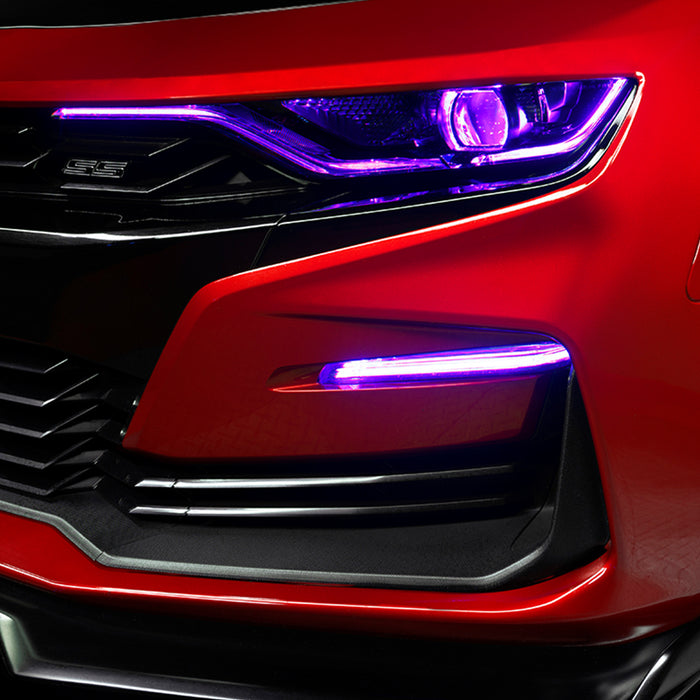 Close-up on a red Chevrolet Camaro with purple fog light DRLs.