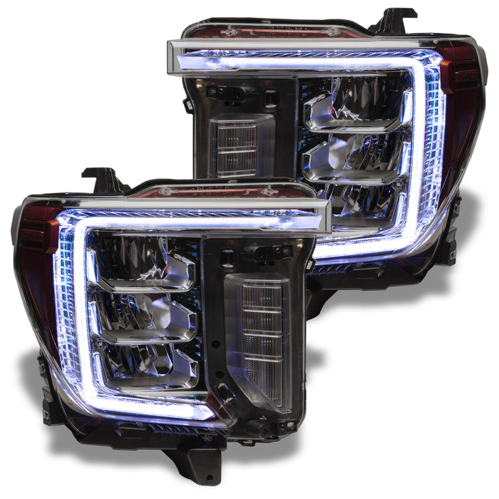 GMC Sierra headlights with white DRLs.