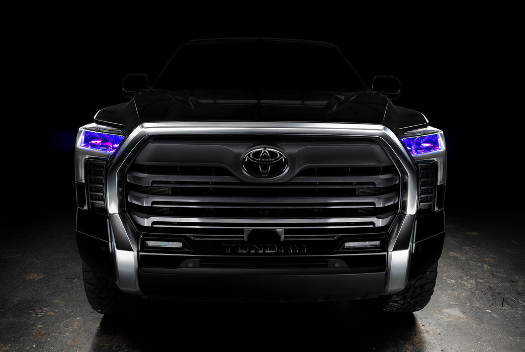 Straight front view of a black Toyota Tundra with purple demon eye projectors.