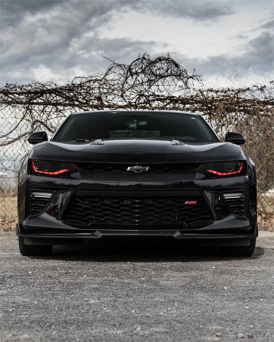 Front view of a Chevrolet Camaro with red headlight DRLs.