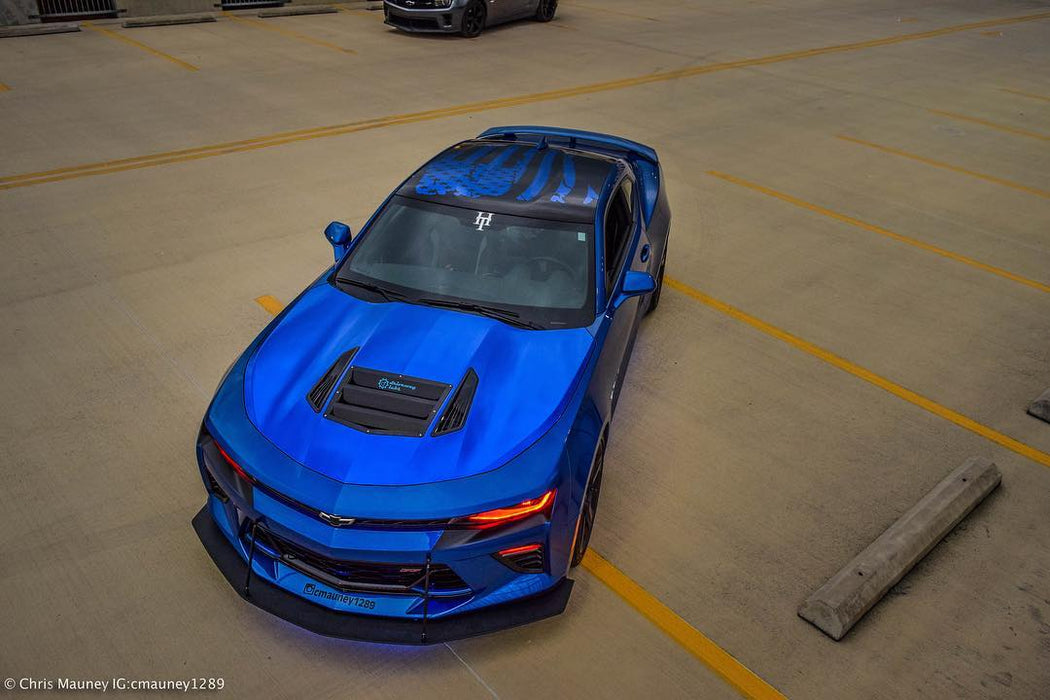 Blue camaro in parking garage with red DRL and camaro lurking in background