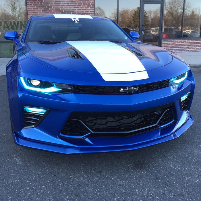 Front end of a Chevrolet Camaro with cyan LED headlight and fog light DRLs.