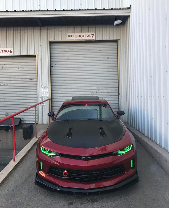 Red Camaro with green halos and DRLs.