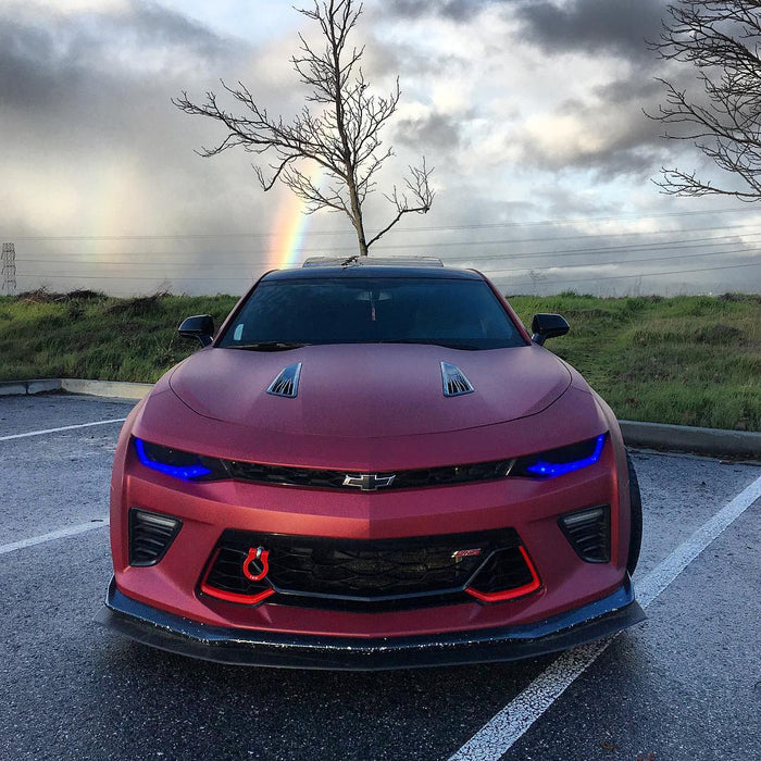 Front view of a Chevrolet Camaro with blue headlight DRLs.