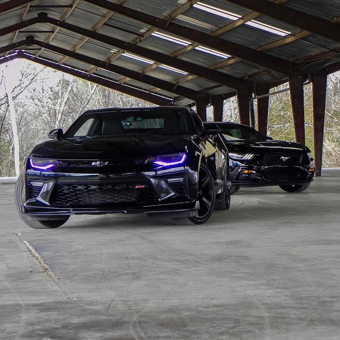 Front end of a Chevrolet Camaro with purple headlight DRLs.