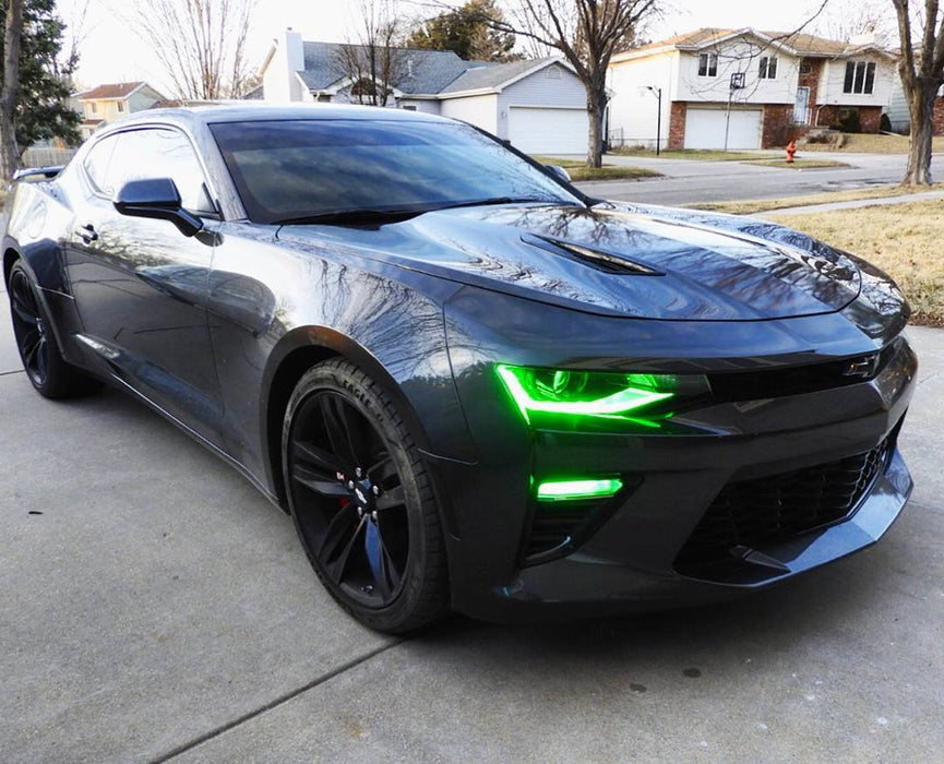Three quarters view of a Chevrolet Camaro with green headlight and fog light DRLs.