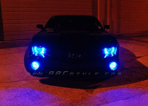 Front end of a Chevrolet Camaro with blue LED headlight and fog light halo rings installed.
