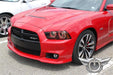 Front end of a red Dodge Charger with red LED headlight halo rings installed.