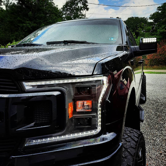 2015-2020 Ford F-150 LED Off-Road Side Mirrors installed on a black Ford F-150