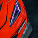 Close-up of a C8 Corvette headlight with purple DRLs.