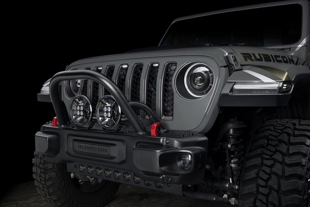 Front end of a Jeep with multiple ORACLE Lighting products installed, including LED Integrated Skid Plate, Oculus Headlights, and 9" Spotlights.