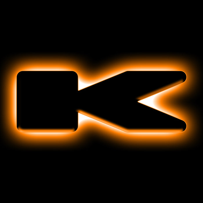 The letter "K" Amber LED Illuminated Letter Badge with matte black finish.