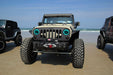 Front end of a Jeep Wrangler JK with cyan LED headlight halos installed.