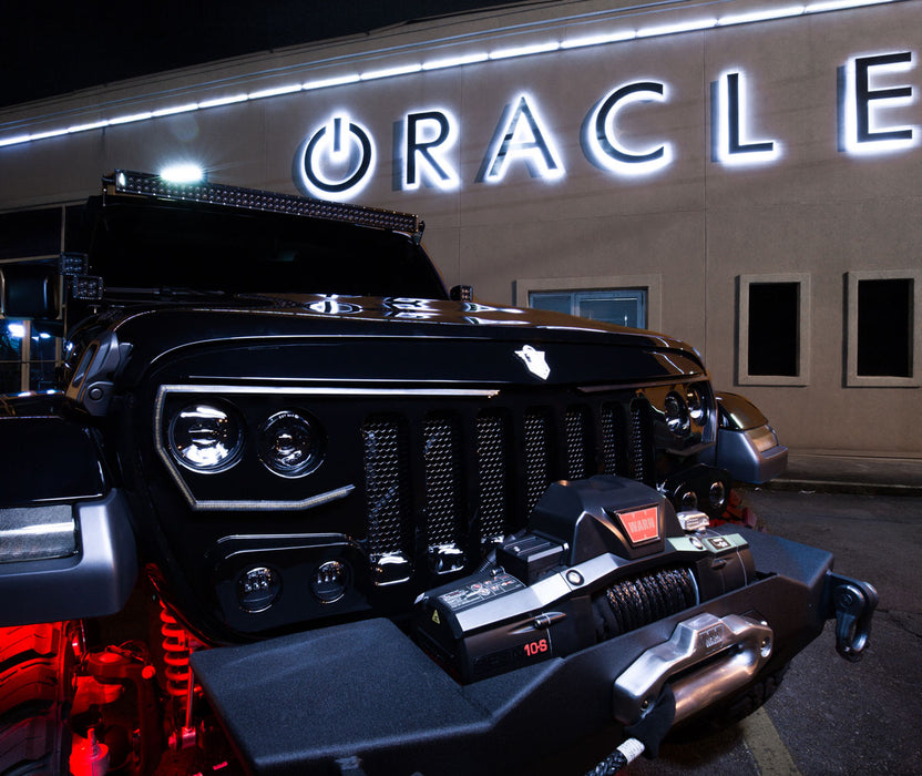 Front end of a Jeep Wrangler with Black Series - 7D 3" 20W LED Square Spot/Flood Lights installed on the dashboard.